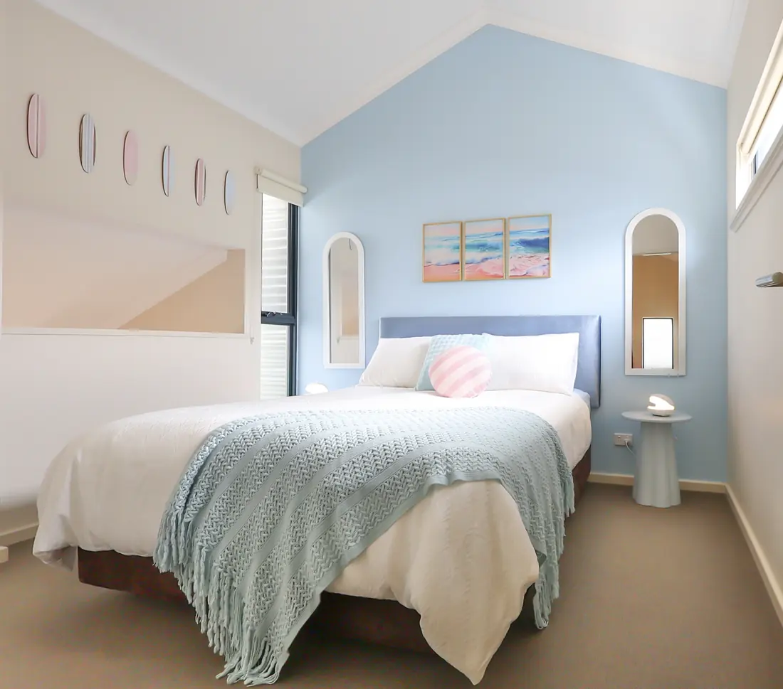 Main bedroom upstairs under a vaulted ceiling
