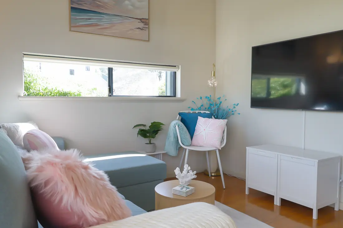 Living area with a sofa and television