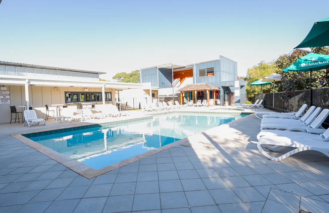 The resort swimming pool and sun lounges